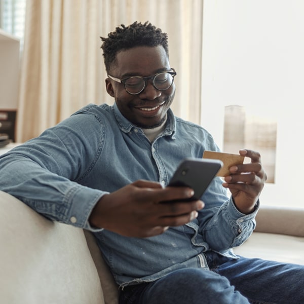 man on phone with credit card